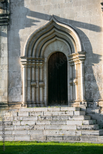 The entrance, framed by an arched perspective portal in the tradition of old Russian architecture, was built in the 15th century. Moscow. Russia.