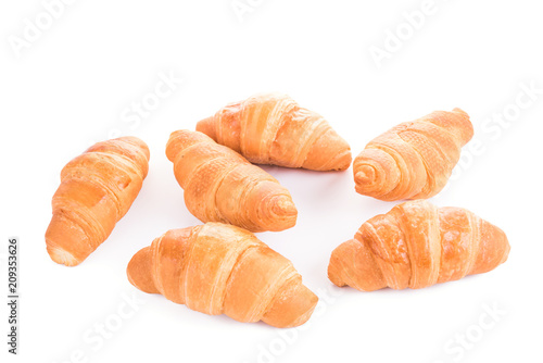 Fresh croissants isolated over white background