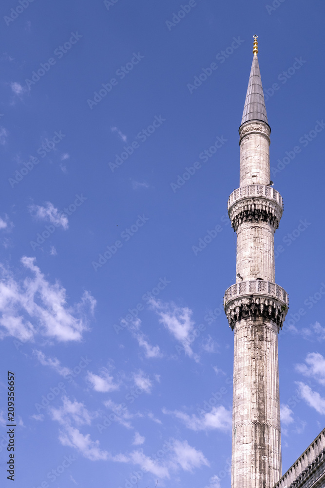 Mosque, minarets against a clear blue sky on a sunny day