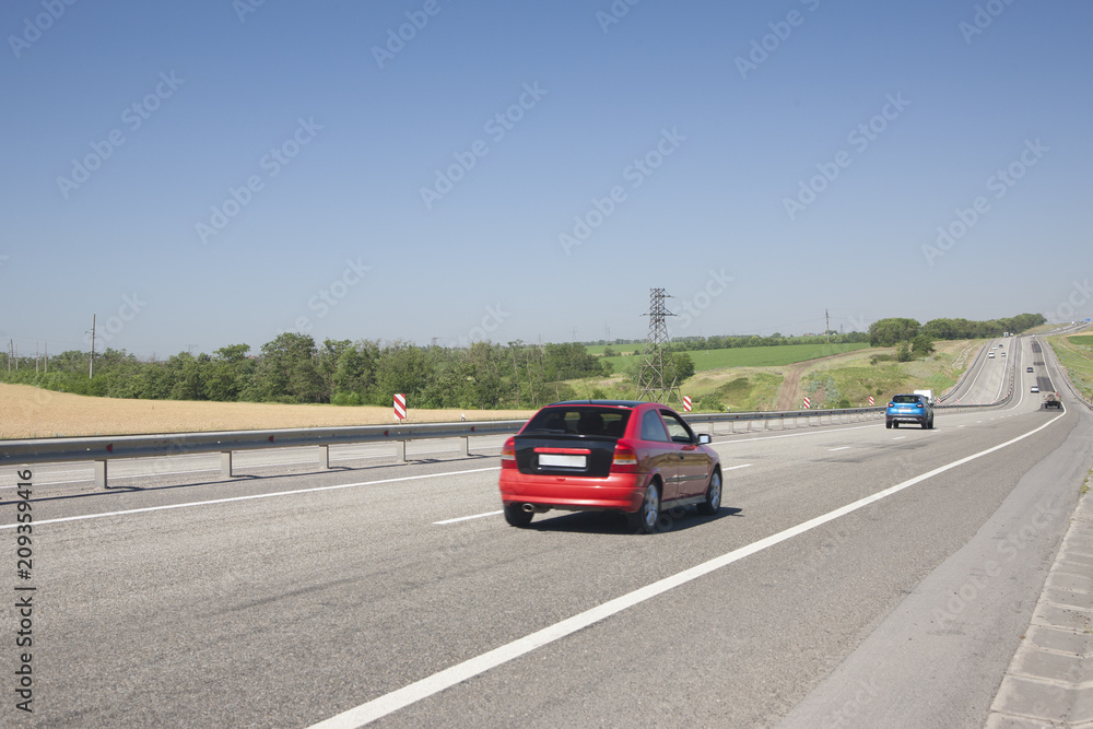 Cars are driving fast on the highway