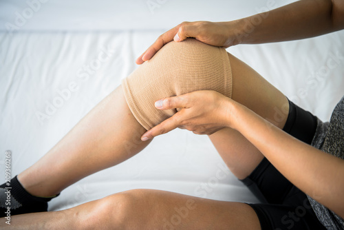 Women use knee supporter to prevent injuries.