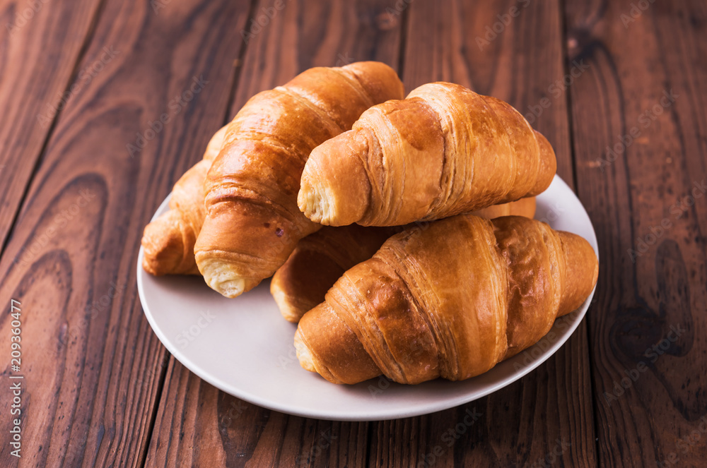 Freshly baked butter croissant. Closeup