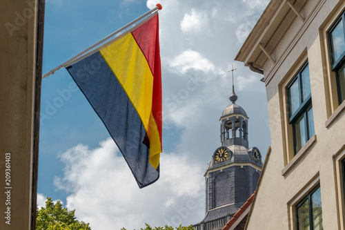 Vlaardingen, The Netherlands, church tower and town flag photo