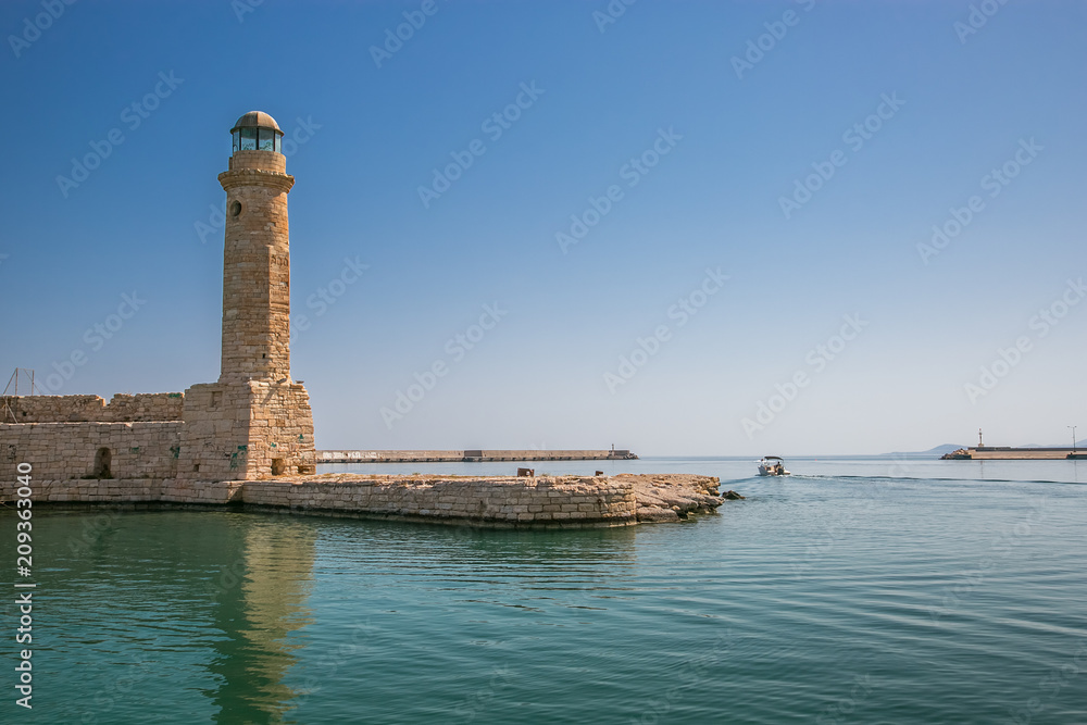 harbor and lighthouse of the city of rethymno in in crete greece 