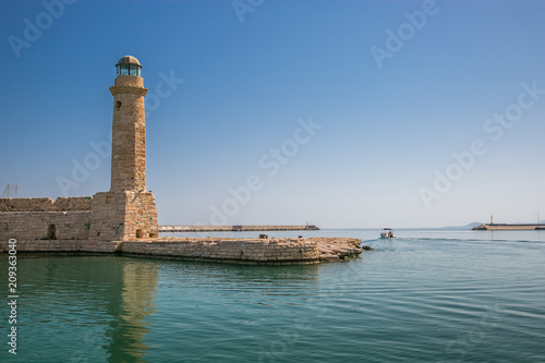 harbor and lighthouse of the city of rethymno in in crete greece 