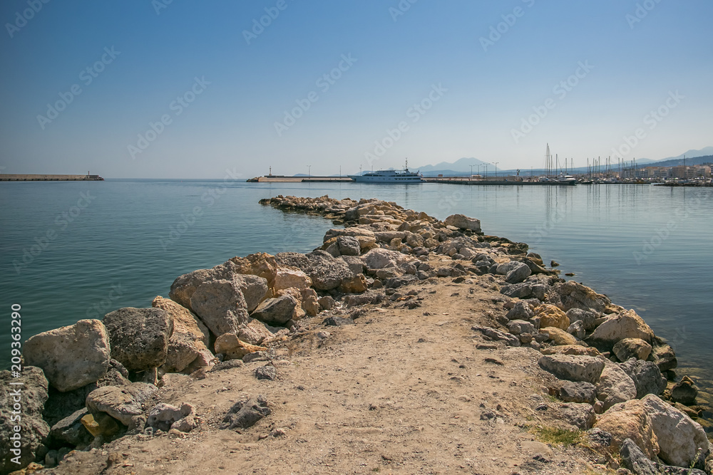 harbor and lighthouse of the city of rethymno in in crete greece harbor and lighthouse of the city of rethymno in in crete greece