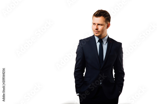 young handsome businessman holding a football isolated on white background studio. photo