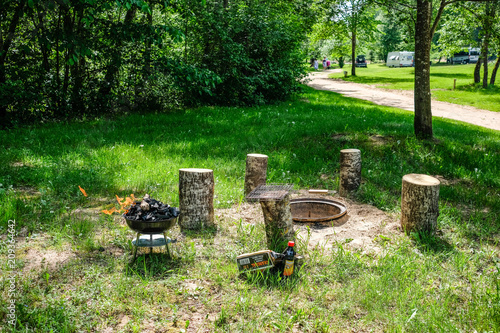 Fire on barbecue charcoal grill. Grilling food on a weber type small cheap BBQ grill at home.