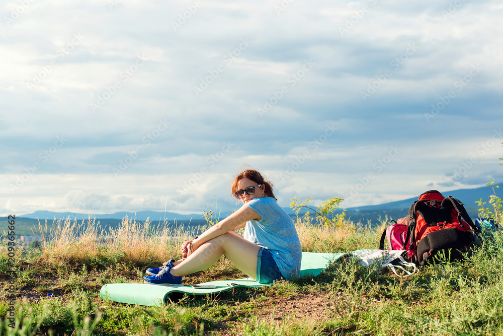 Young girl traveler hiker have a rest. Young girl traveler hiker have a rest.