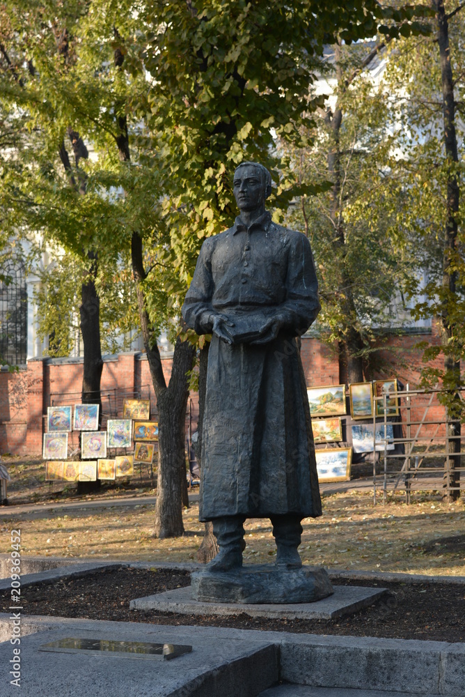 monument on the background of buildings and structures monument on the background of buildings and structures