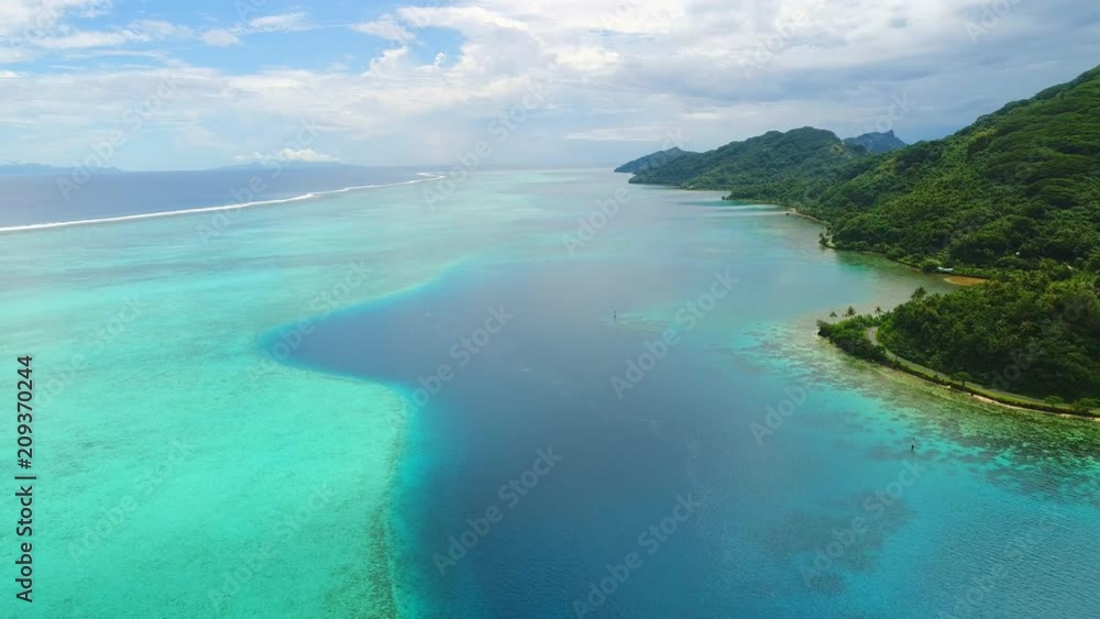 Aerial panoramic view of tropical paradise of Huahine island, turquoise clear water of blue lagoon, lush green rain forest, white sand beaches - Pacific Ocean, landscape panorama of French Polynesia Aerial panoramic view of tropical paradise of Huahine island, turquoise clear water of blue lagoon, lush green rain forest, white sand beaches - Pacific Ocean, landscape panorama of French Polynesia