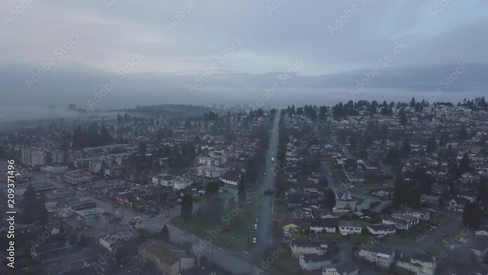 Aerial view of the city suburbs during a foggy winter sunrise. Taken in New Westminster, Greater Vancouver, British Columbia, Canada.
Aerial view of the city suburbs during a foggy winter sunrise. Taken in New Westminster, Greater Vancouver, British Columbia, Canada.