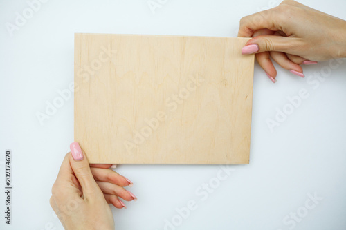 Office Woman Hands Holding a A Tree Board on White Background. Copyspace. Place for Text. © Maksymiv Iurii