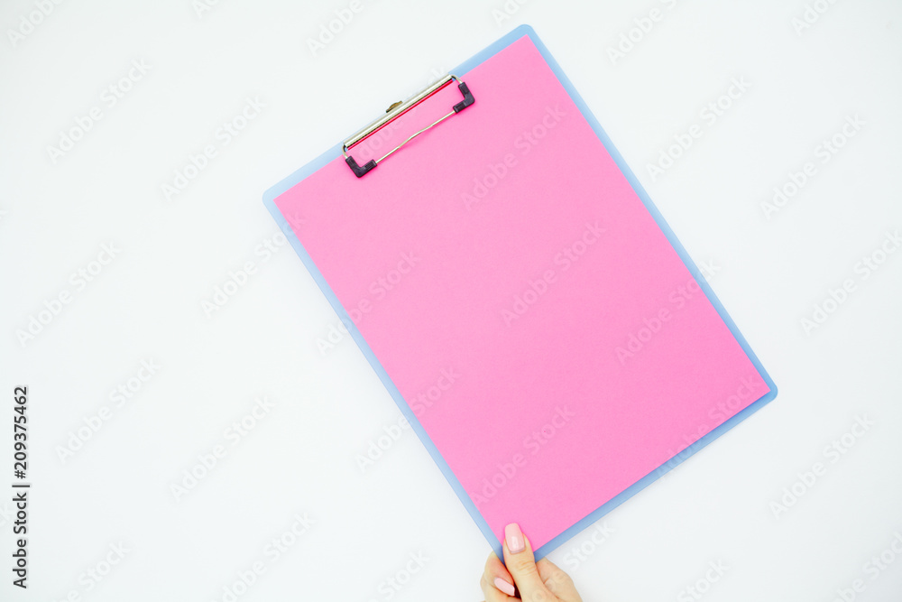 Blank Folder with Pink Paper. Hand that Holding Folder and Handle on White Background. Copyspace. Place for Text. Blank Folder with Pink Paper. Hand that Holding Folder and Handle on White Background. Copyspace. Place for Text.