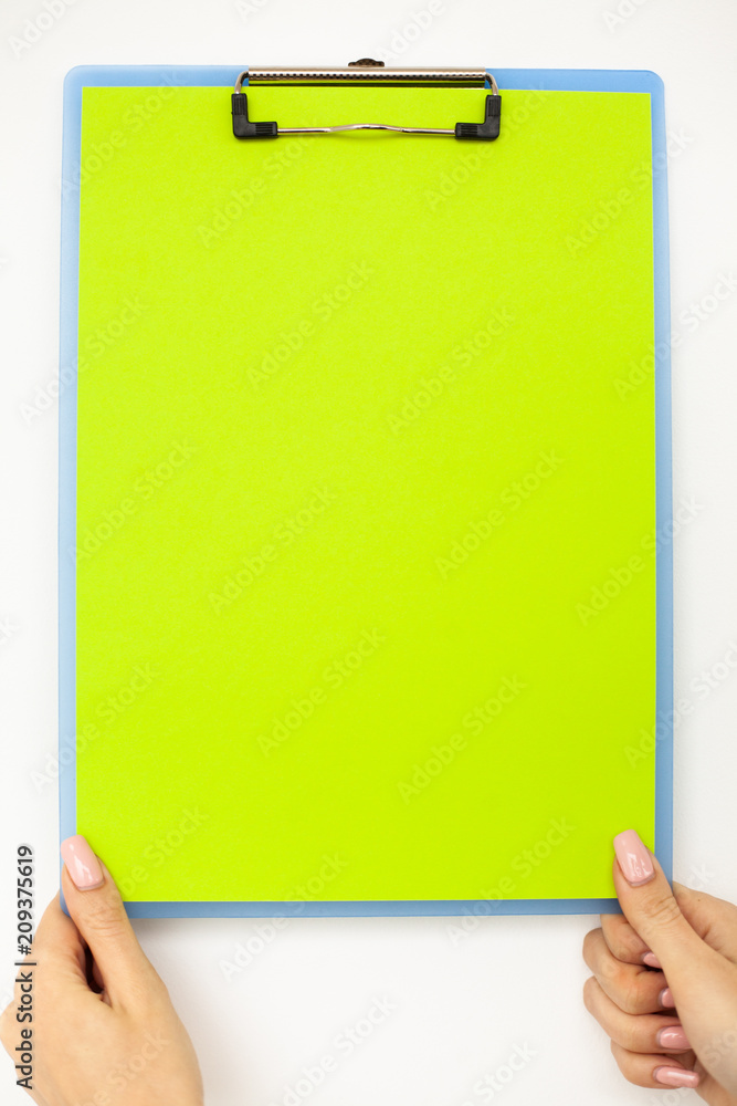 Blank Folder with Green Paper. Hand that Holding Folder and Handle on White Background. Copyspace. Place for Text. Blank Folder with Green Paper. Hand that Holding Folder and Handle on White Background. Copyspace. Place for Text.