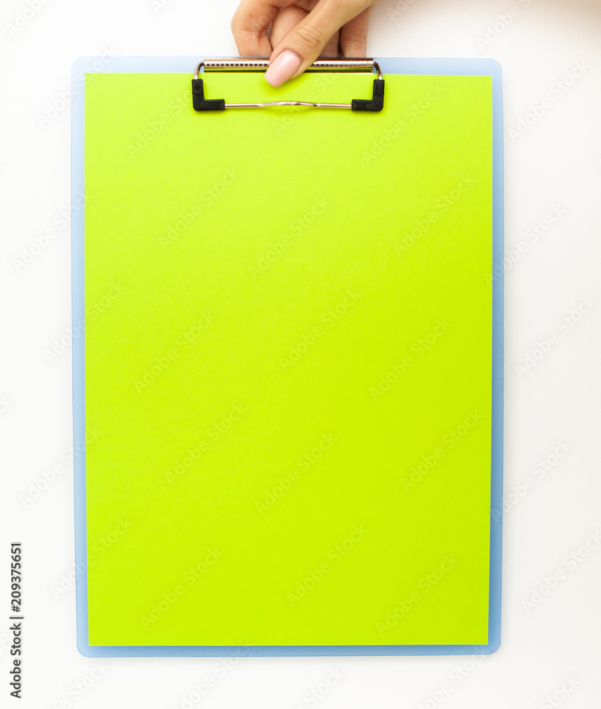 Blank Folder with Green Paper. Hand that Holding Folder and Handle on White Background. Copyspace. Place for Text. Blank Folder with Green Paper. Hand that Holding Folder and Handle on White Background. Copyspace. Place for Text.