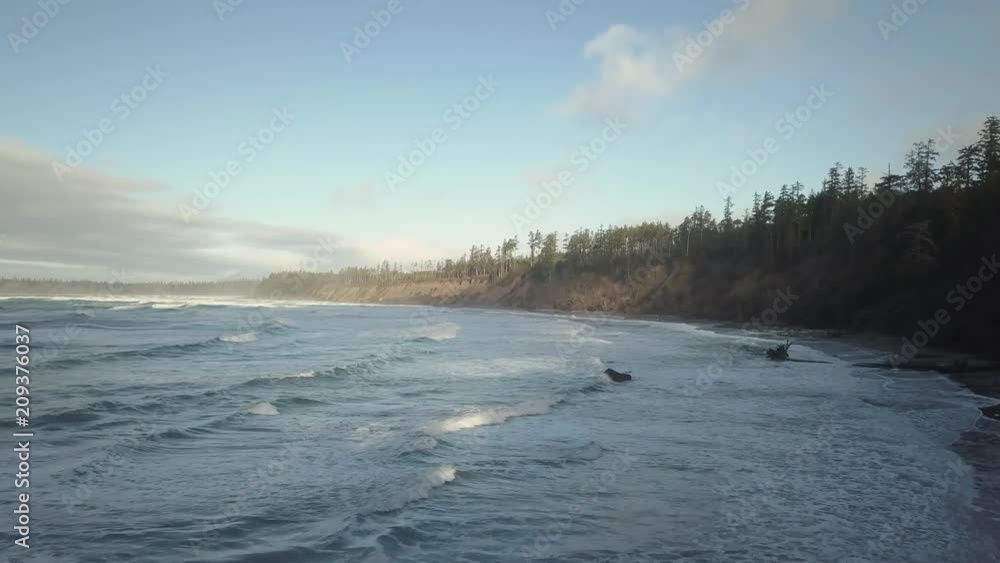 Aerial view of the beautiful Seascape at the Pacific Ocean Coast during a vibrant winter sunrise. Taken near Tofino and Ucluelet in Vancouver Island, British Columbia, Canada. Aerial view of the beautiful Seascape at the Pacific Ocean Coast during a vibrant winter sunrise. Taken near Tofino and Ucluelet in Vancouver Island, British Columbia, Canada.