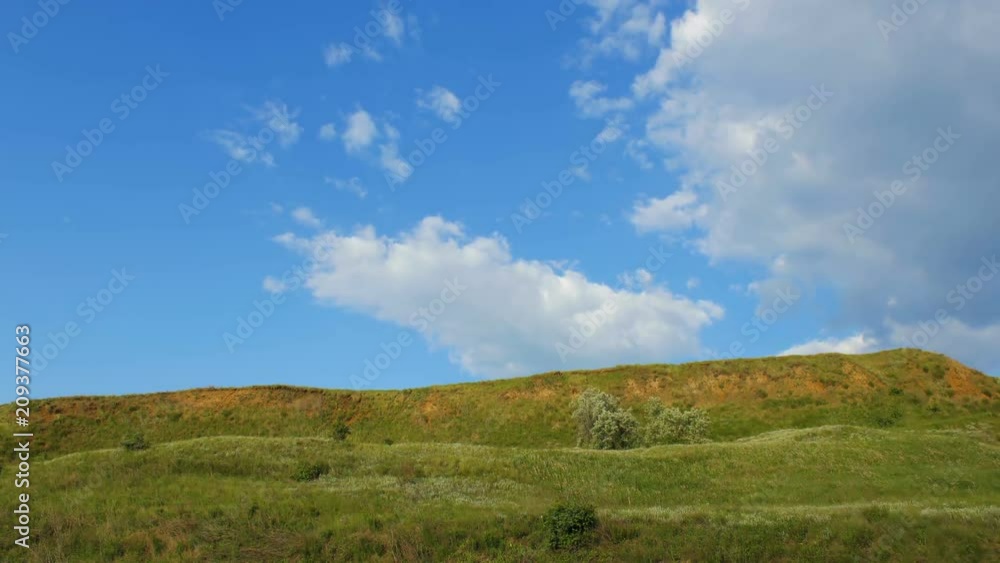 Clouds move outside the hills. Natural landscape timelapse. Hills with sunny sky. Clouds move outside the hills. Natural landscape timelapse. Hills with sunny sky.