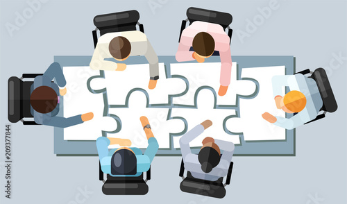 Business meeting strategy brainstorming concept. Vector illustration in an aerial view with people sitting in an office around a conference table solving a puzzle