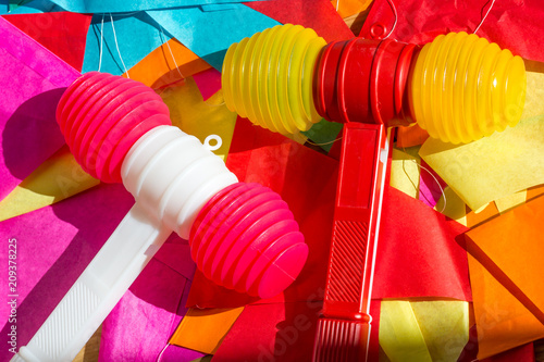 Bright colorful plastic toy hammers and bunting for celebrating the feast of St. John the Baptist in Porto, Portugal