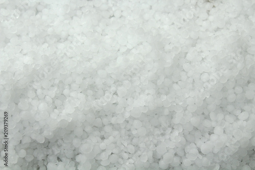 White round frozen hail. Icy raindrops. Close-up. Background. Texture.