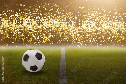 Fußball im Stadion vor hellen goldenen Lichtern © OFC Pictures