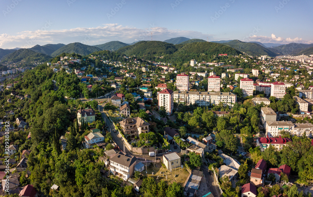 Aerial drone view on Tuapse city and hills on horizone at day time in summer