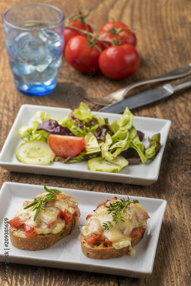 baguette with melted cheese and salad baguette with melted cheese and salad