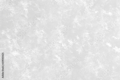 The background is white. The texture of the brilliant snow for the New Year's postcard.