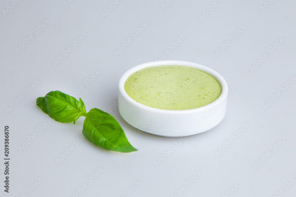 cream soup with greens on the plate is decorated with mint leaves cream soup with greens on the plate is decorated with mint leaves
