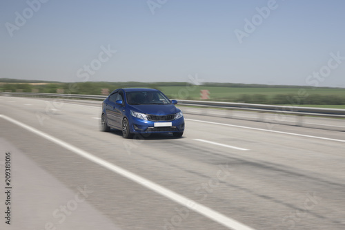 The car quickly rides on the highway © biggur