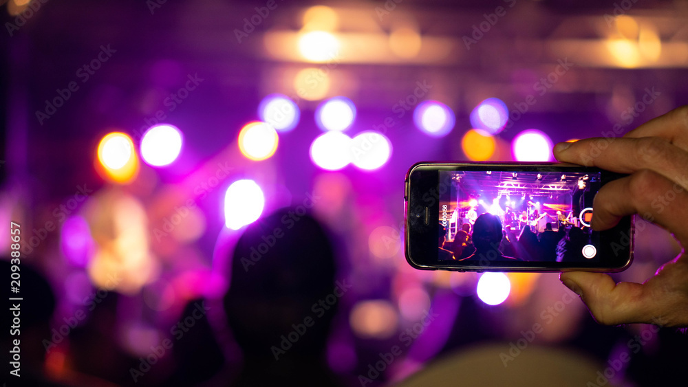 People holding their smart phones and photographing concert. Open air Rock Festival in Germany People holding their smart phones and photographing concert. Open air Rock Festival in Germany