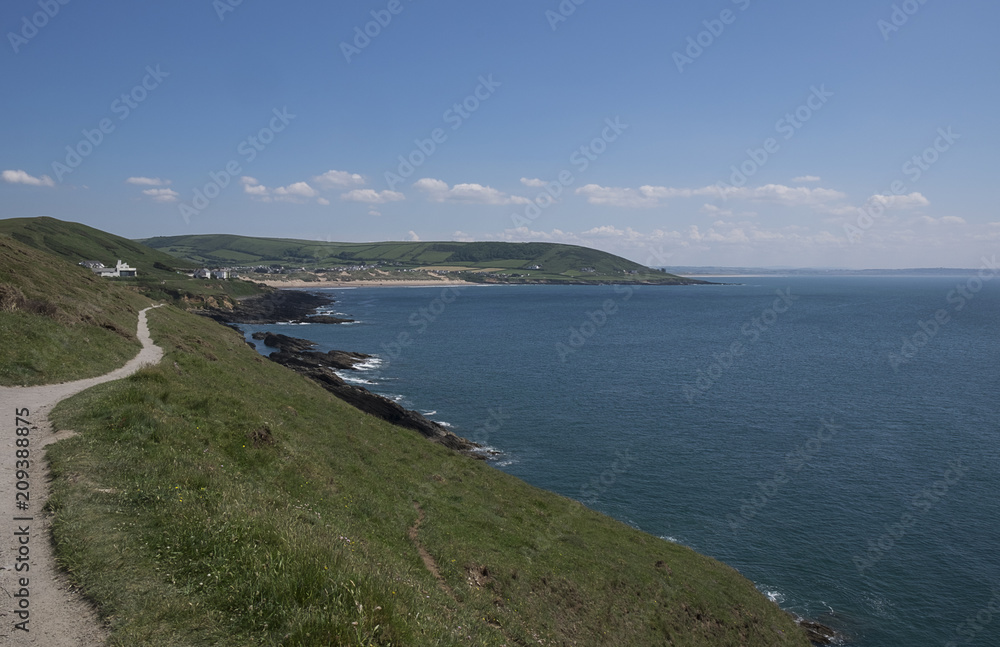 View of Croyde beach with blue sea and sky on a sunny day in the summer. from Baggy Point coastal path. North Devon, United Kingdom