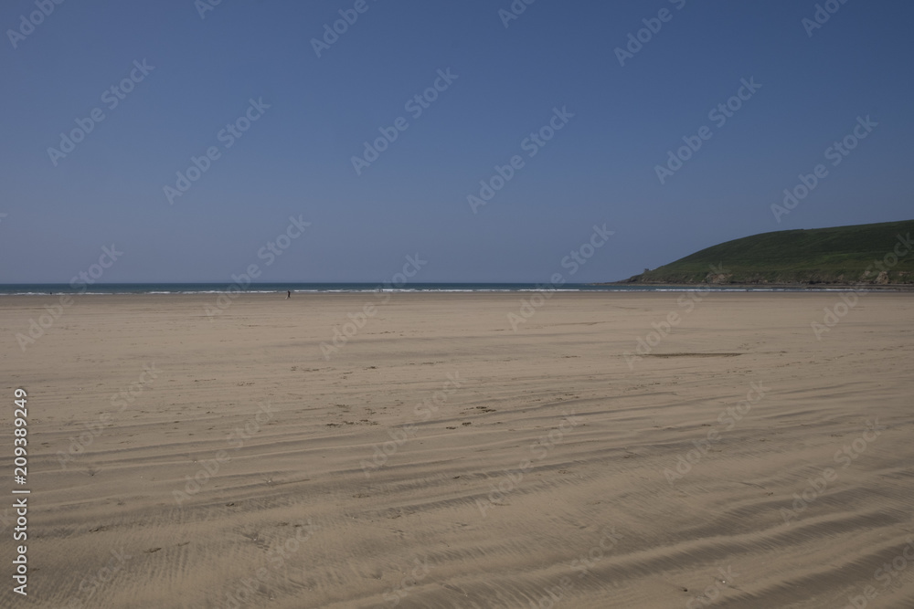 Saunton Sands beach on a sunny day in the summer. North Devon, United Kingdom Saunton Sands beach on a sunny day in the summer. North Devon, United Kingdom