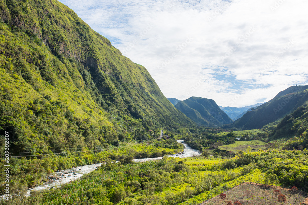 Intag Valley from the ground looking at the river Intag and houses with blue sky in Ecuador near  Otavalo