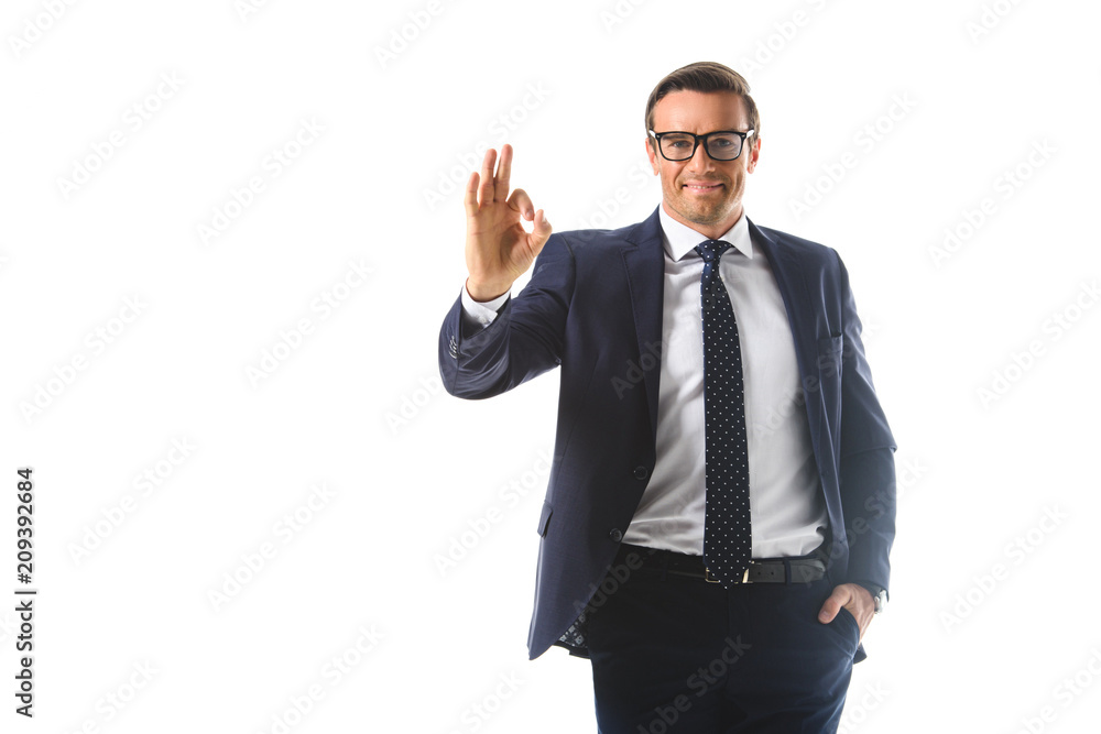 smiling businessman in eyeglasses showing ok gesture isolated on white background smiling businessman in eyeglasses showing ok gesture isolated on white background