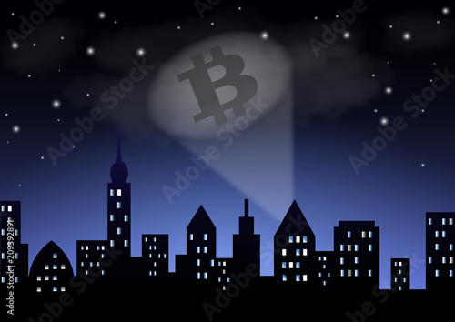 The light from the searchlight shows the crypto-currency bitcoin over the night city.