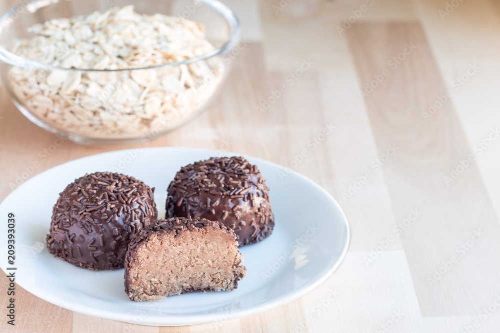 Swedish sweets Arrack balls, made from cookie crumbs, cocoa, butter and coconut wine Arrack flavour, horizontal, copy space Swedish sweets Arrack balls, made from cookie crumbs, cocoa, butter and coconut wine Arrack flavour, horizontal, copy space