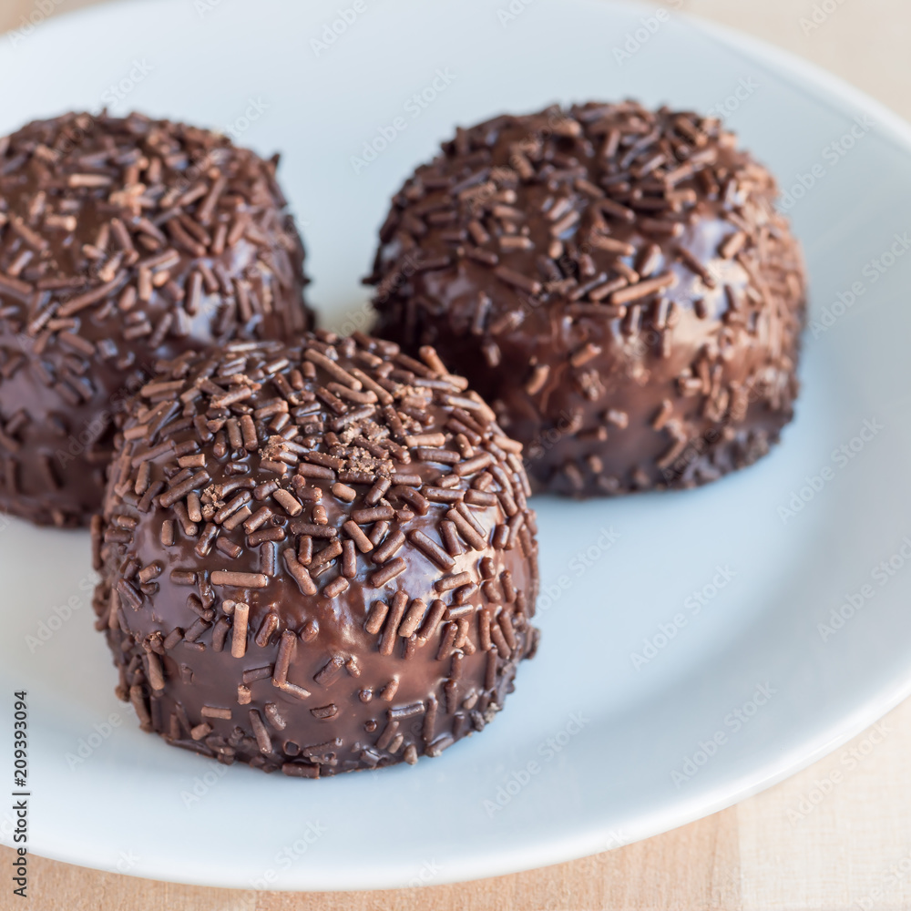 Swedish sweets Arrack balls, made from cookie crumbs, cocoa, butter and coconut wine Arrack flavour, square format, closeup Swedish sweets Arrack balls, made from cookie crumbs, cocoa, butter and coconut wine Arrack flavour, square format, closeup
