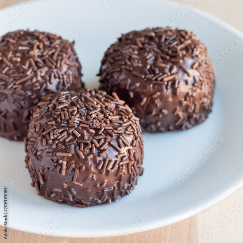 Swedish sweets Arrack balls, made from cookie crumbs, cocoa, butter and coconut wine Arrack flavour, square format, closeup © iuliia_n