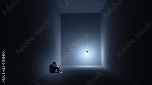 Bild auf Leinwand Ein Mann sitzt depressiv in einem Raum mit einer Glühbirne