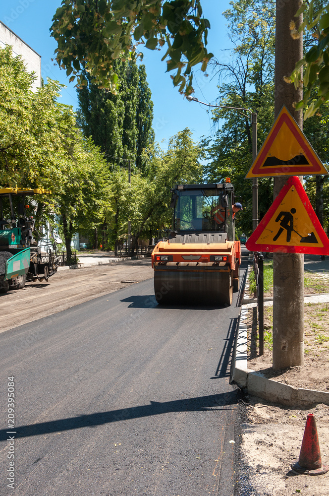 piling expensive new asphalt in the city piling expensive new asphalt in the city