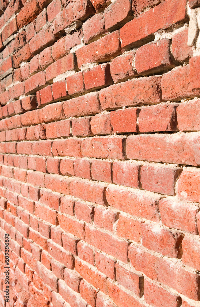 Obraz premium Masonry: Old retaining brick wall with flushed out joints in Eastern Germany