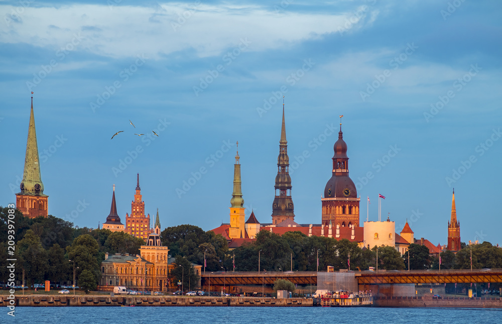 Evening view on historical center of old Riga - the capital of Latvia and famous Baltic city known among tourists due to its unique medieval and Gothic architecture