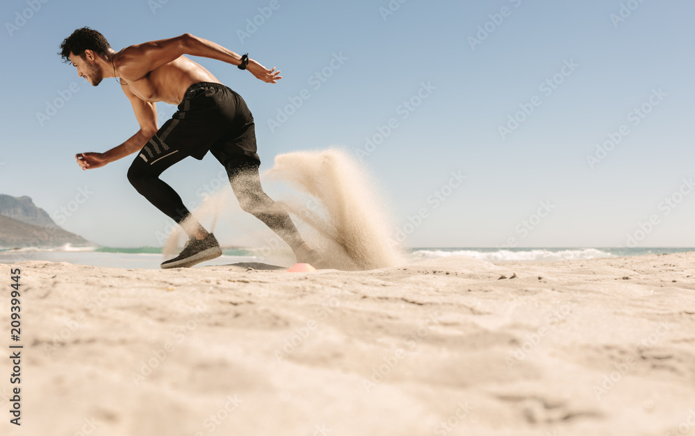 Man running on the beach Man running on the beach