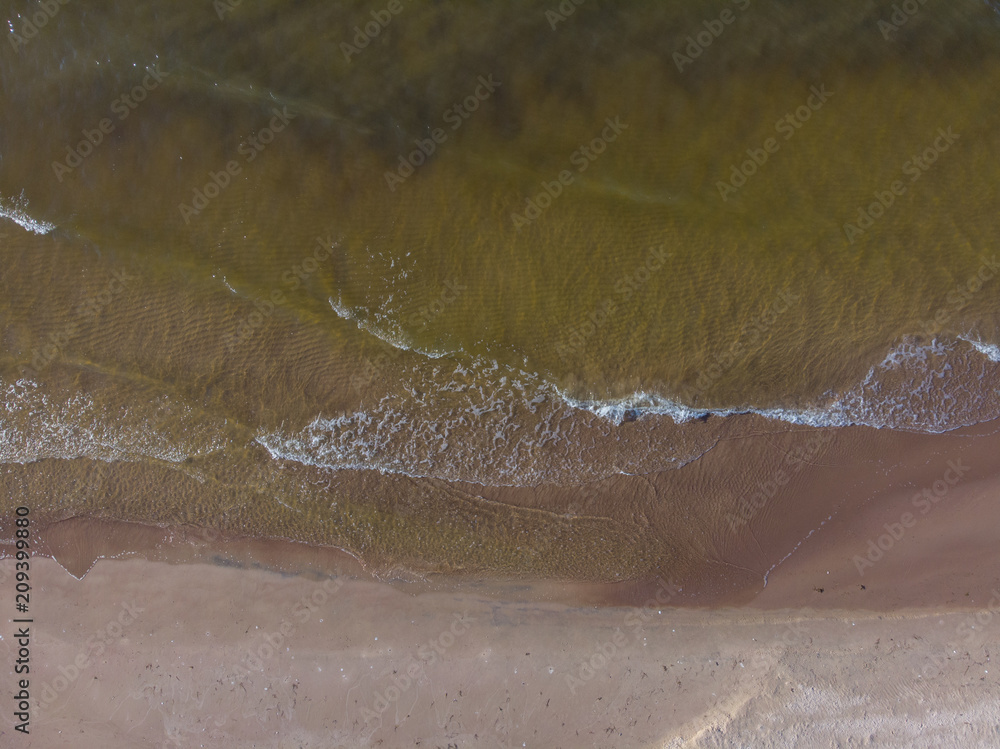 Fototapeta premium top view on brilliant sea and sand coastlake