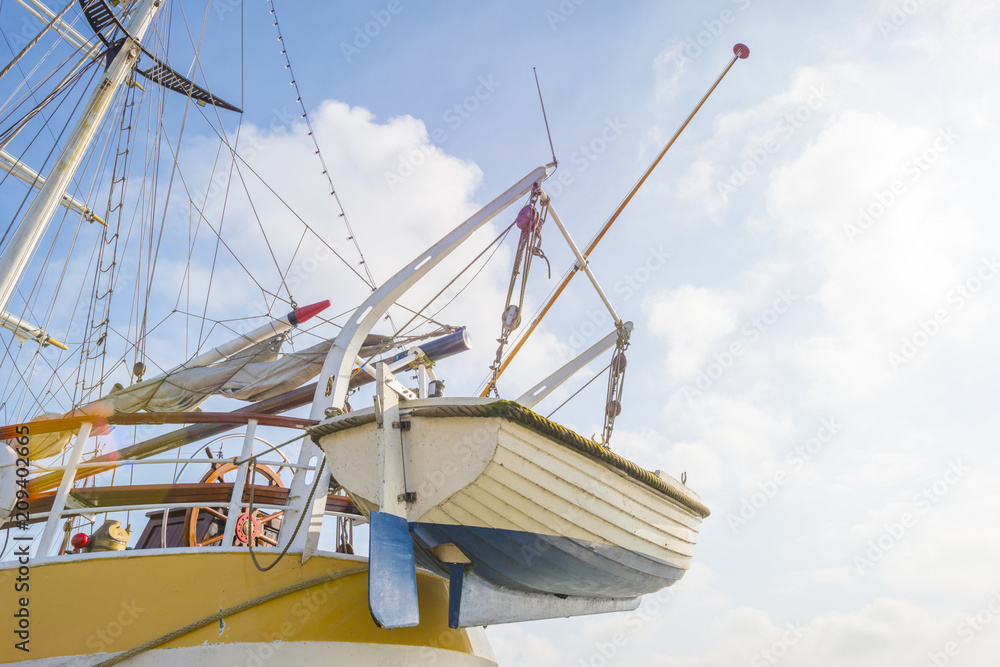 Rigging of a tall ship in a port in sunlight in spring