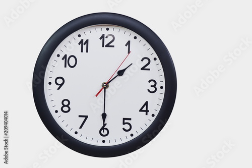 Time concept with black clock at half past one