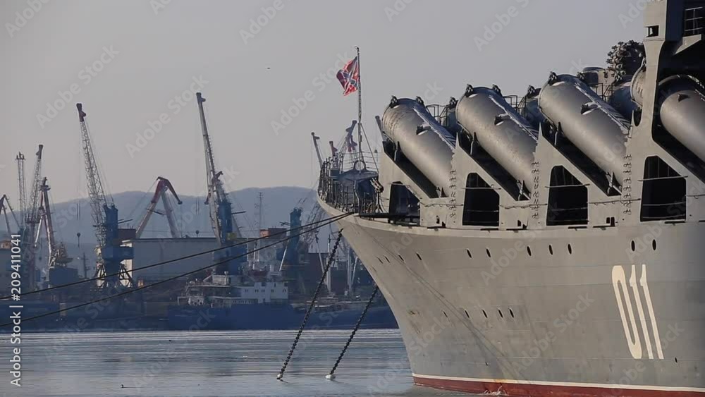 The St. Andrew's flag is developed on a military naval ship at the military berth in Vladivostok