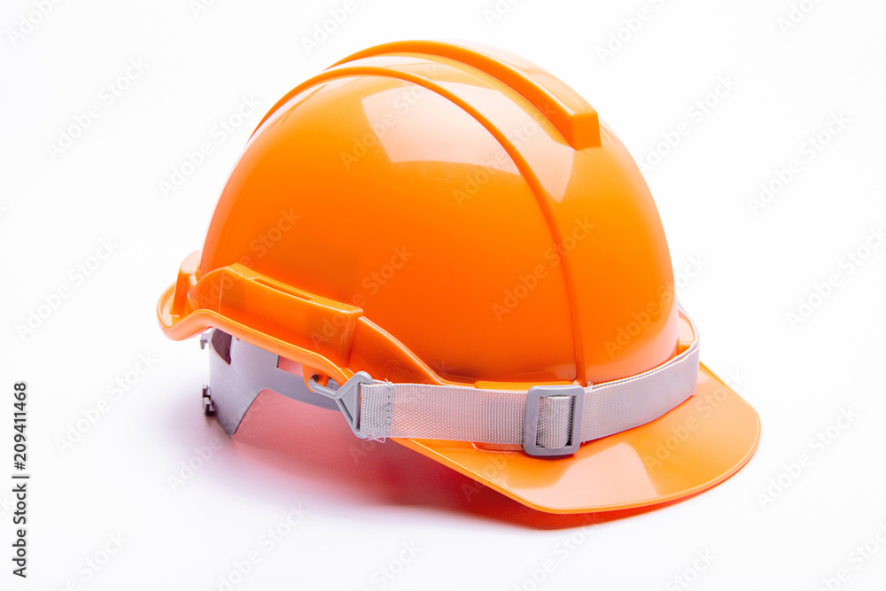 Orange safety helmet construction on white background. Orange safety helmet construction on white background.